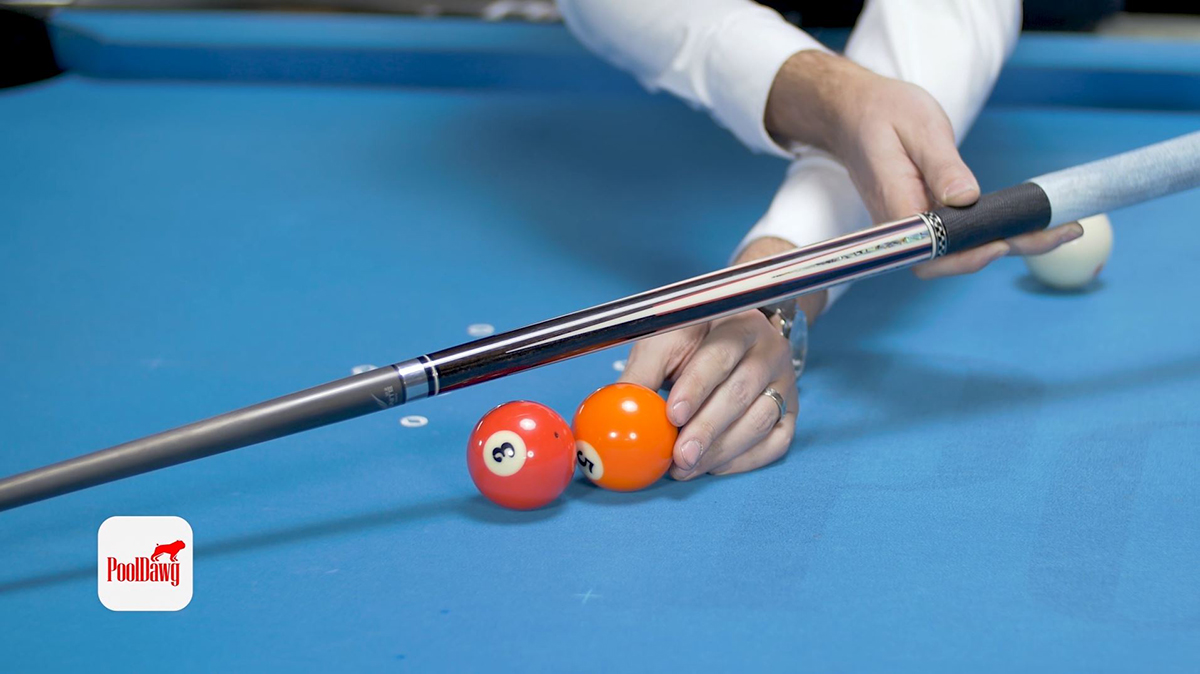 Valerie lines up the five ball to visualize the aiming position referred to as the “ghost ball”