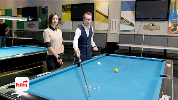 Florian uses his cue to predict the tangent line and impact point of the cue ball on the end rail