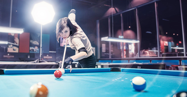 Valérie Bédard jumping a pool ball from PoolDawg’s Advanced Billiard Instruction Lesson